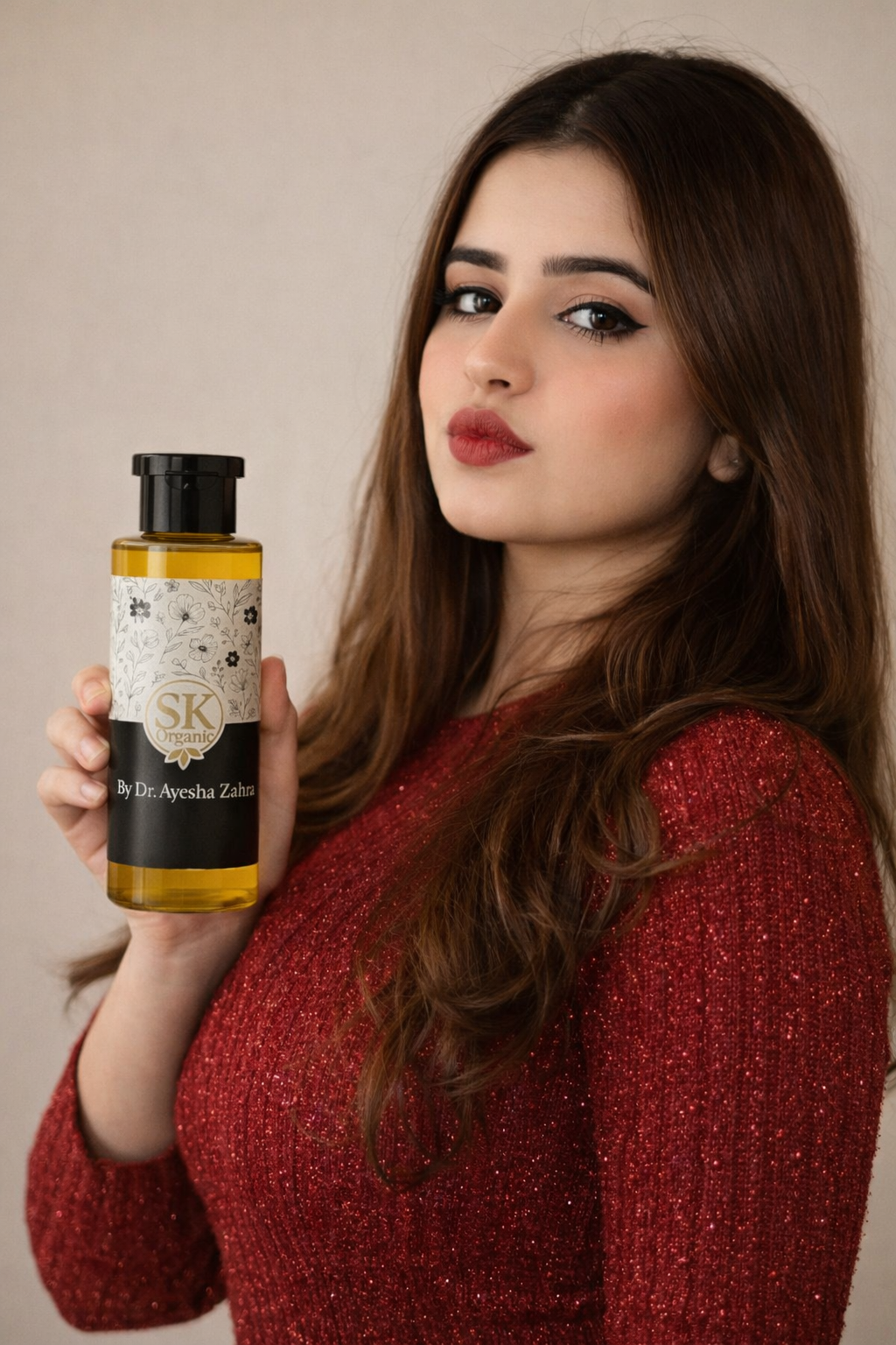 Sk SK Oil by Dr. Ayesha Zahra, a clear bottle of nourishing skincare oil with a black cap and label, on a white background.